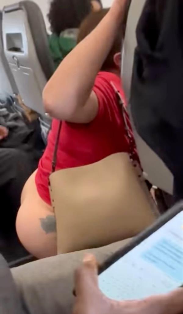The woman's squatting drew protests from her fellow passengers.